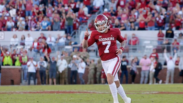 Oklahoma QB Spencer Rattler runs after throwing touchdown